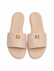 Sandalias Coach Slide Nude Acolchadas con Logo Dorado