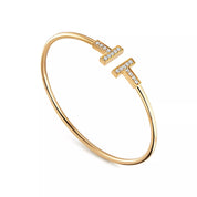 Pulsera Tiffany T Wire Dorada Con Zirconias